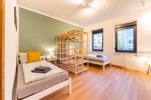 a room with a bed and a bunk bed at Monteurwohnung Dresden-Klotzsche I in Dresden