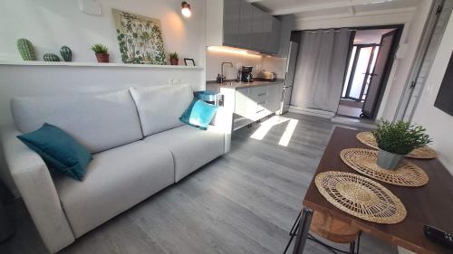 a living room with a couch and a table at Topdown Apartments in Hospitalet de Llobregat