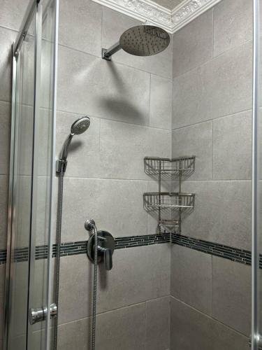 a shower with a shower head in a bathroom at Chesapeake Bay 42 in Margate