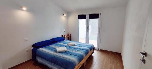 Postel nebo postele na pokoji v ubytování Casa Nonno Remo