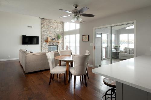 a kitchen and living room with a table and chairs at 21 Mile Marker Overlook in Osage Beach