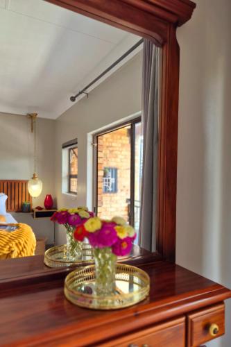 Ένα ή περισσότερα κρεβάτια σε δωμάτιο στο Highveld Guesthouse