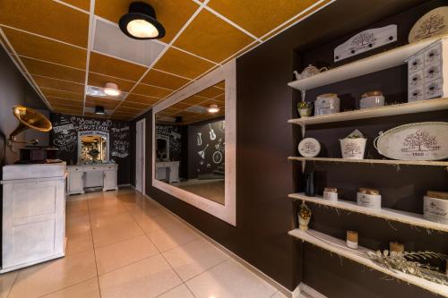a store with plates and dishes on shelves at Ambassador Plaza in Kyiv