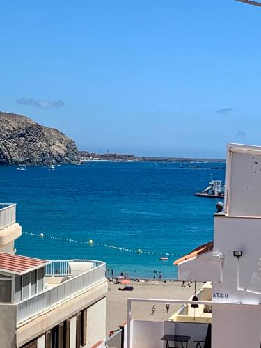 a view of the beach from a building at Habitación Sencilla in Arona