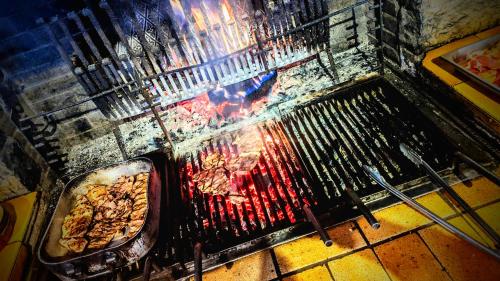 a grill with a bunch of food in it at Le Bataclan in Auron