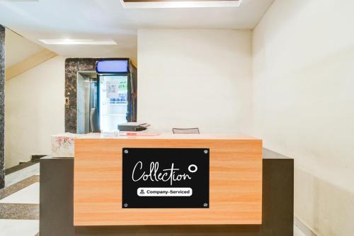 a cashier counter with a sign on it at Super Collection O Malkajgiri in Hyderabad