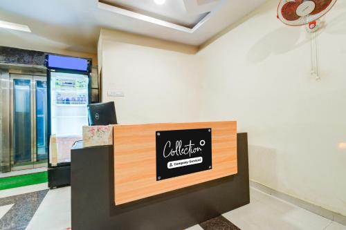 an office with a sign on the wall at Super Collection O Malkajgiri in Hyderabad