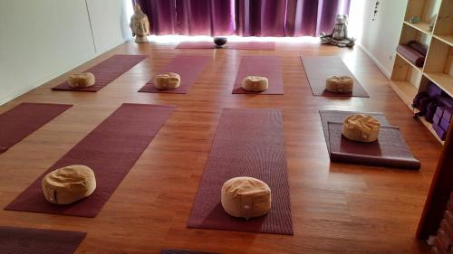 a group of yoga mats on the floor of a room at Naturkost-Hotel Harz in Bad Grund
