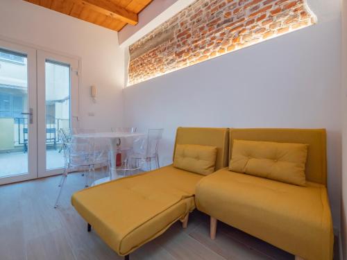a living room with a couch and a table at Luxury apartment - Flumendosa 5 in Milan