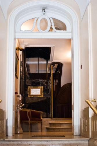a stairway leading to a room with a bed at Hotel Frossard in Buenos Aires