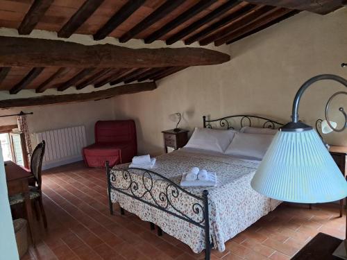 Postel nebo postele na pokoji v ubytování Fra Paolino B&B - Locanda di Montisi