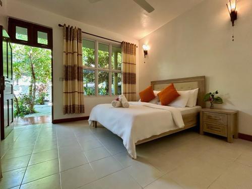 Postel nebo postele na pokoji v ubytování Dhangethi Retreat