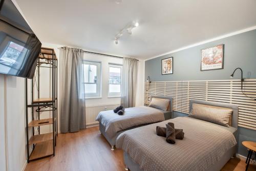 Postel nebo postele na pokoji v ubytování Amalfi A08 - super zentral für 4PP - 2 Zimmer & Boxspringbetten