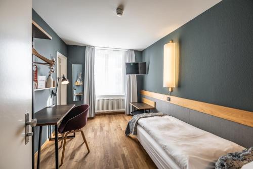 Una cama o camas en una habitación de Hotel Jakob