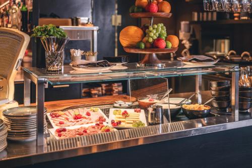 a buffet line with food on a table at Hotel Jakob in Rapperswil-Jona