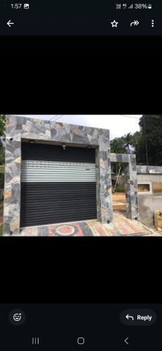 a picture of a stone fireplace with a window at Ella Aman Vanicia Resort in Ella