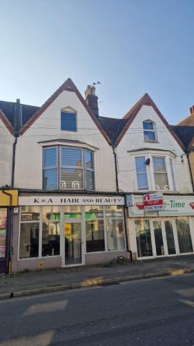 a store on the side of a street at Coastal Gateway FREE CAR PARK, town centre in Eastbourne