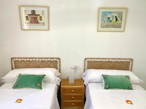 two beds sitting next to each other in a room at Casa Segovia By Solymar Holiday in Caleta De Velez