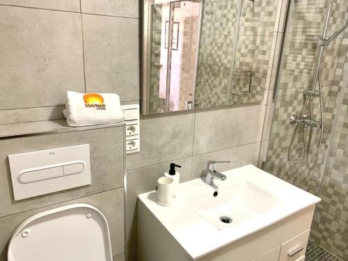 a bathroom with a toilet and a sink at Casa Segovia By Solymar Holiday in Caleta De Velez