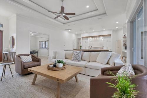 a living room with a couch and a table at SAN3337 Canalfront Vacation Pool Home in Punta Gorda