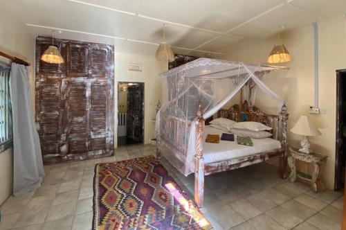 Ένα ή περισσότερα κρεβάτια σε δωμάτιο στο Papa Beach House
