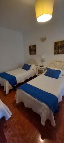 Postel nebo postele na pokoji v ubytování Hostal Las Cadenas