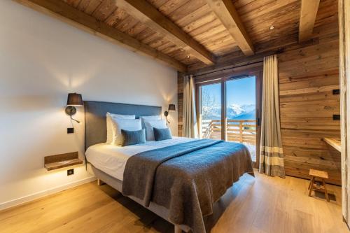Katil atau katil-katil dalam bilik di Le Chalet Baan - avec vue sur les montagnes