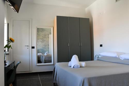Hotel Le Palmeにあるベッド
