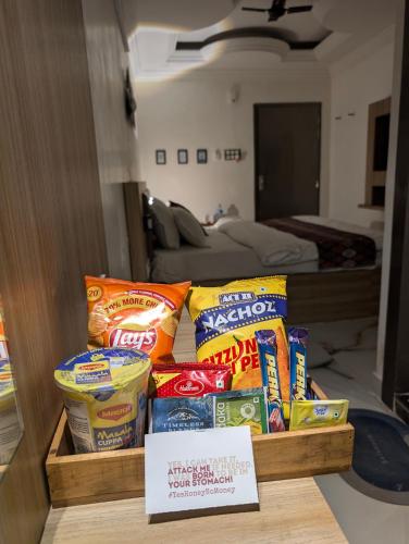 a pile of chips and other snacks on a table at The Vibs International in Damoh