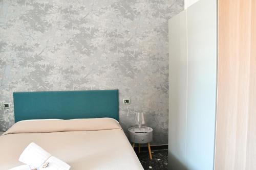 Hotel Le Palmeにあるベッド