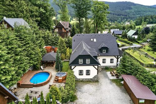 an aerial view of a house with a swimming pool at Penzion Ostruznik in Ostružná