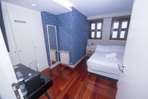 Ένα ή περισσότερα κρεβάτια σε δωμάτιο στο Hotel O Semaforo
