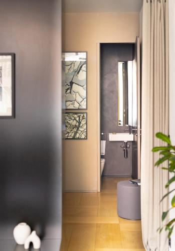 a bathroom with a toilet and a sink at The Hamlet - Luxury Serviced Apartments in Geneva