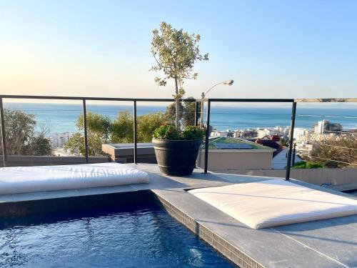 a swimming pool on the roof of a house at Cape20 - Luxury Villa Stay in Cape Town