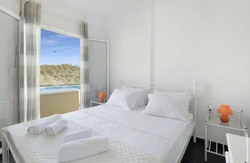Ένα ή περισσότερα κρεβάτια σε δωμάτιο στο Villa Amaryllis