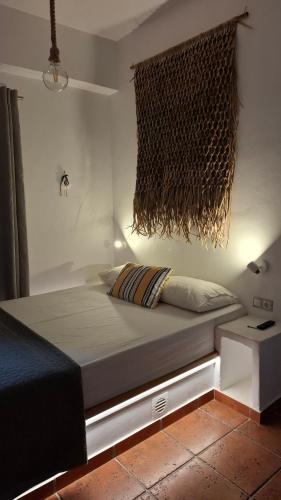 a bed sitting in a room with at OFIOYSA KaGa kythnosuites in Mérikhas