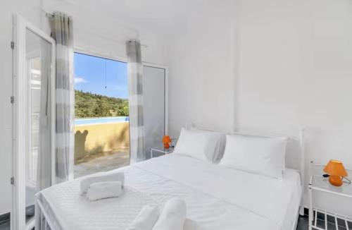 Ένα ή περισσότερα κρεβάτια σε δωμάτιο στο Villa Μyrsini