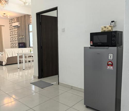Η κουζίνα ή μικρή κουζίνα στο Padang Serai Wangi Homestay