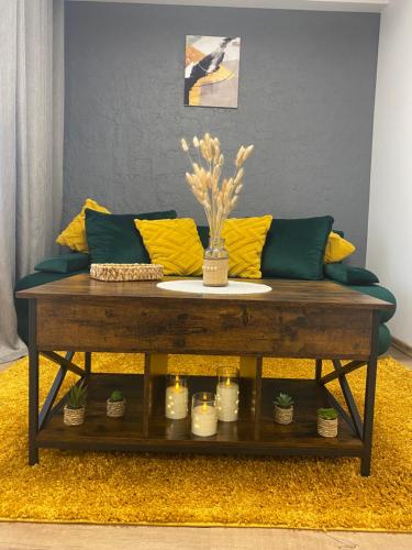 a coffee table with a couch in a living room at Centro apartments Rokiškis in Rokiškis
