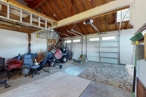 a garage with a motorcycle parked in it at Bella Mare in Elk