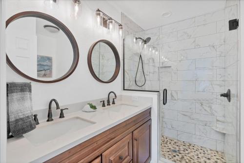 a bathroom with a sink and two mirrors at BVC265 Punta Gorda Isles in Punta Gorda