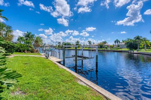 a canal in a park with palm trees and a blue sky at BVC265 Punta Gorda Isles in Punta Gorda