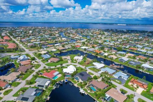 an aerial view of a city with houses and the water at BVC265 Punta Gorda Isles in Punta Gorda