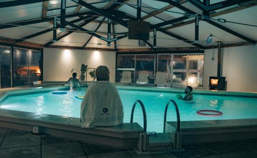 a group of people in a swimming pool at Hotel Palma de Mallorca in La Paloma