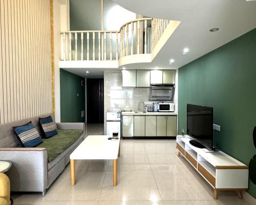 Kuchyň nebo kuchyňský kout v ubytování April Fair Duplex Apartment Guagnzhou South Railway Station Min Jie Branch