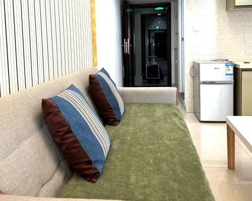 Posezení v ubytování April Fair Duplex Apartment Guagnzhou South Railway Station Min Jie Branch