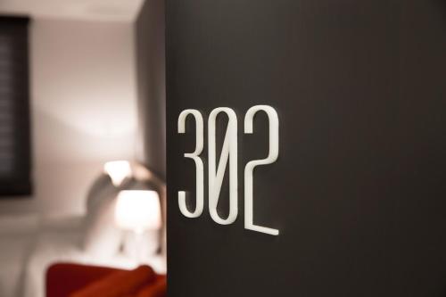 a close up of a clock on a wall at Nova Hotel Yerevan in Yerevan