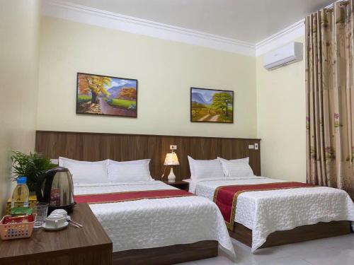 Postel nebo postele na pokoji v ubytování TAM CỐC ĐỨC VÂN HOMESTAY