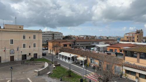 a city with a bus parked in a street at Centro storico - Ottimo Collegamento aeroportuale e Roma in Fiumicino