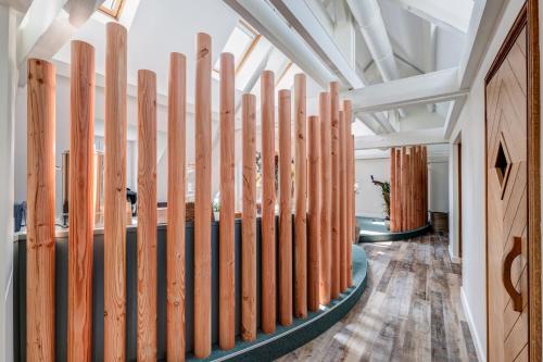 a row of wooden skis lined up in a hallway at Château des Avenieres in Cruseilles
